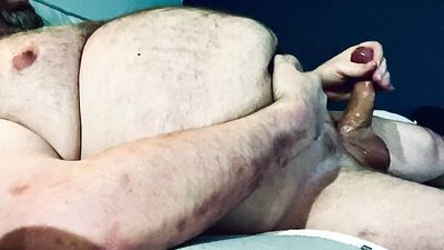 FAT DADDY STROKING HIS THICK UNCUT COCK ON THE COUCH