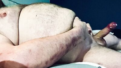 FAT DADDY STROKING HIS THICK UNCUT COCK ON THE COUCH