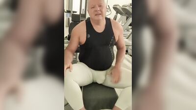 Tight white tights in a public gym at night