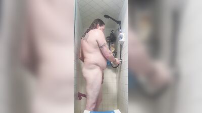Chubby white guy Neil sucks and fucks dildo in the shower
