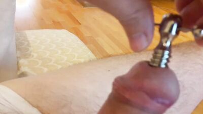 Penis tuner hollow screw urethral plug insertion and a cumshot through