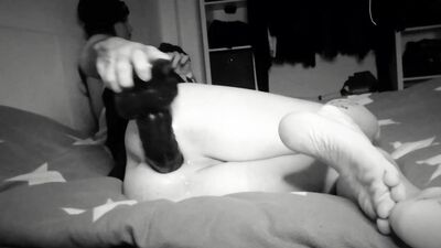 in bed with a fat black dildo for my asshole