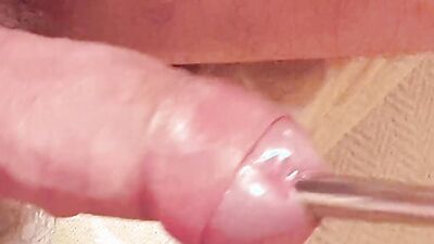 Extreme deep cock sounding close up and a cumshot while sounding rod is fully inside