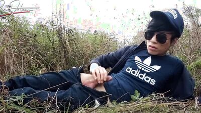 Cute gay Asian twink Jon Arteen speaks French wanks his smooth penis in the rain, lubricated with his saliva moans ejaculates