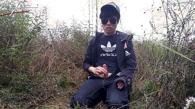 Cute gay Asian twink Jon Arteen speaks French wanks his smooth penis in the rain, lubricated with his saliva moans ejaculates