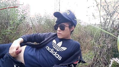 Cute gay Asian twink Jon Arteen speaks French wanks his smooth penis in the rain, lubricated with his saliva moans ejaculates