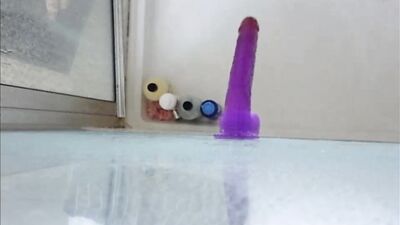 Dildo ass fucking in the shower