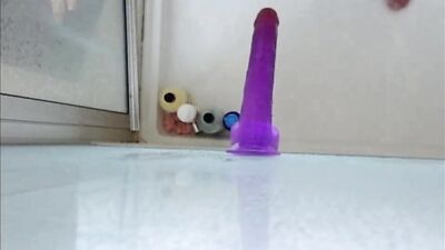 Dildo ass fucking in the shower