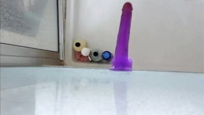 Dildo ass fucking in the shower