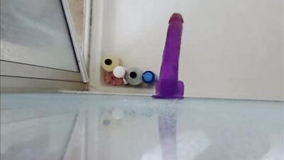 Dildo ass fucking in the shower