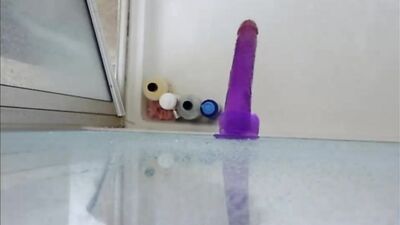 Dildo ass fucking in the shower