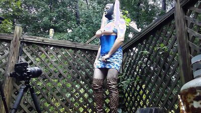 Corseted big fake tits crossdresser in thigh high boots and tight skirt BTS photoshoot cumming hard