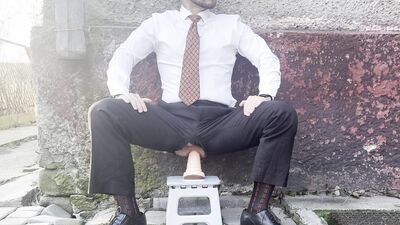 Kinky gentleman slave spread legs and plays with his ass in a car in public