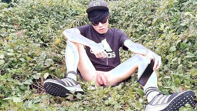 Jon Arteen, a gay Asian twink, is dressed in an Adidas t-shirt, hot pants, white socks, and Duramo sneakers. He jerks off