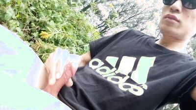 Jon Arteen, a gay Asian twink, is dressed in an Adidas t-shirt, hot pants, white socks, and Duramo sneakers. He jerks off