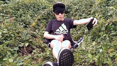 Jon Arteen, a gay Asian twink, is dressed in an Adidas t-shirt, hot pants, white socks, and Duramo sneakers. He jerks off