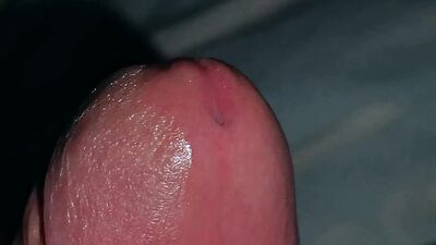 Very close-up of an over-excited penis and streams of pre-cum!