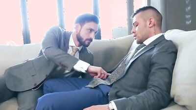 Two horny gay gentlemen are having sex on the couch