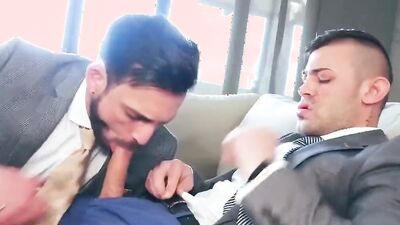 Two horny gay gentlemen are having sex on the couch