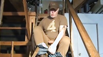 Amateur mature dude is stroking his cock on the stairs