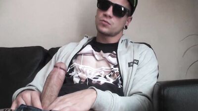 Cool guy jerks his cock casually in front of the camera and cums gigantically