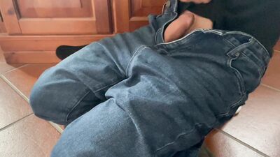 Horny guy on jeans masturbates and cums hard on his belly
