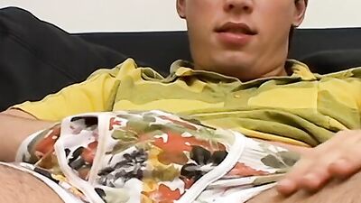 Watch Kyle Valasek tease and stroke his big cock on the sofa with a hot handjob