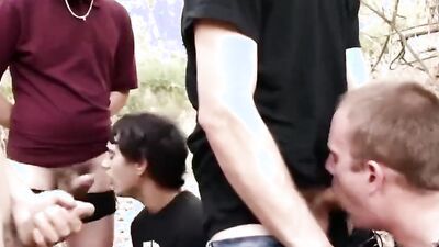 Young punks get wild with big cocks and cum in their mouths in the outdoors