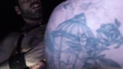 Muscular guy Manny moans while getting his ass pounded by a group of guys at night in Club Crushing