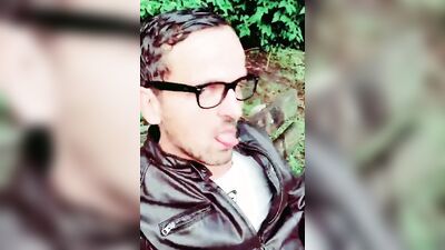 Horny man smokes a cigar and strokes that cock in the woods