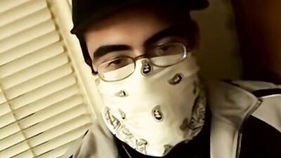 Nerdy bloke is stroking a cock while smoking a cigarette