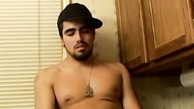 Nerdy bloke is stroking a cock while smoking a cigarette
