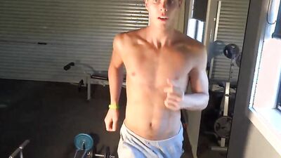 Handsome gay is stretching naked while he's in a quarantine lockdown