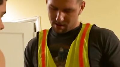 Watch these guys in work clothes get down and dirty with a big cock in a wild threesome